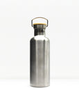Close up of the bottle neck showing a metal cap and wooden lid with a hoop handle