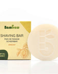 Shaving Bar packaging box labeled APRICOT OIL & VITAMIN E beside a pale soap