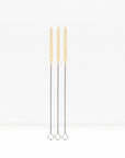 Three cotton straw cleaning brushes with twisted metal handles standing upright against a white background.