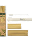 Assorted bamboo straws along with a cloth bag and protective sleeve displaying Bamboo branding.