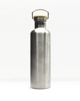 Brushed stainless steel insulated water bottle with a light wood cap and arched metal handle