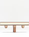 Gold tone safety razor head on a threaded stem against a white background