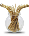 Gold metal drinking straws in a glass jar from a bulk pack of 100