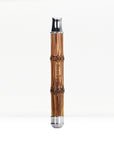 Bamboo safety razor handle with chrome head against a white background