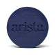 Deep blue circular shampoo bar with arista logo embossed on its surface