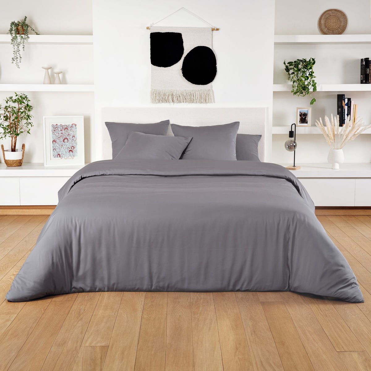 Light gray bamboo duvet cover on a white bed in a bright minimalist bedroom