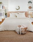 Bed with warm ivory beige Bamboo Duvet Cover and white pillows in a bright minimalist bedroom