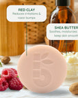 Pale pink shaving bar with a leaf motif in front of raspberries and a bowl of butter in a kitchen scene