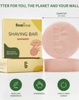 Shaving bar Raspberry packaging featuring red clay and shea butter illustrations beside a pale pink soap