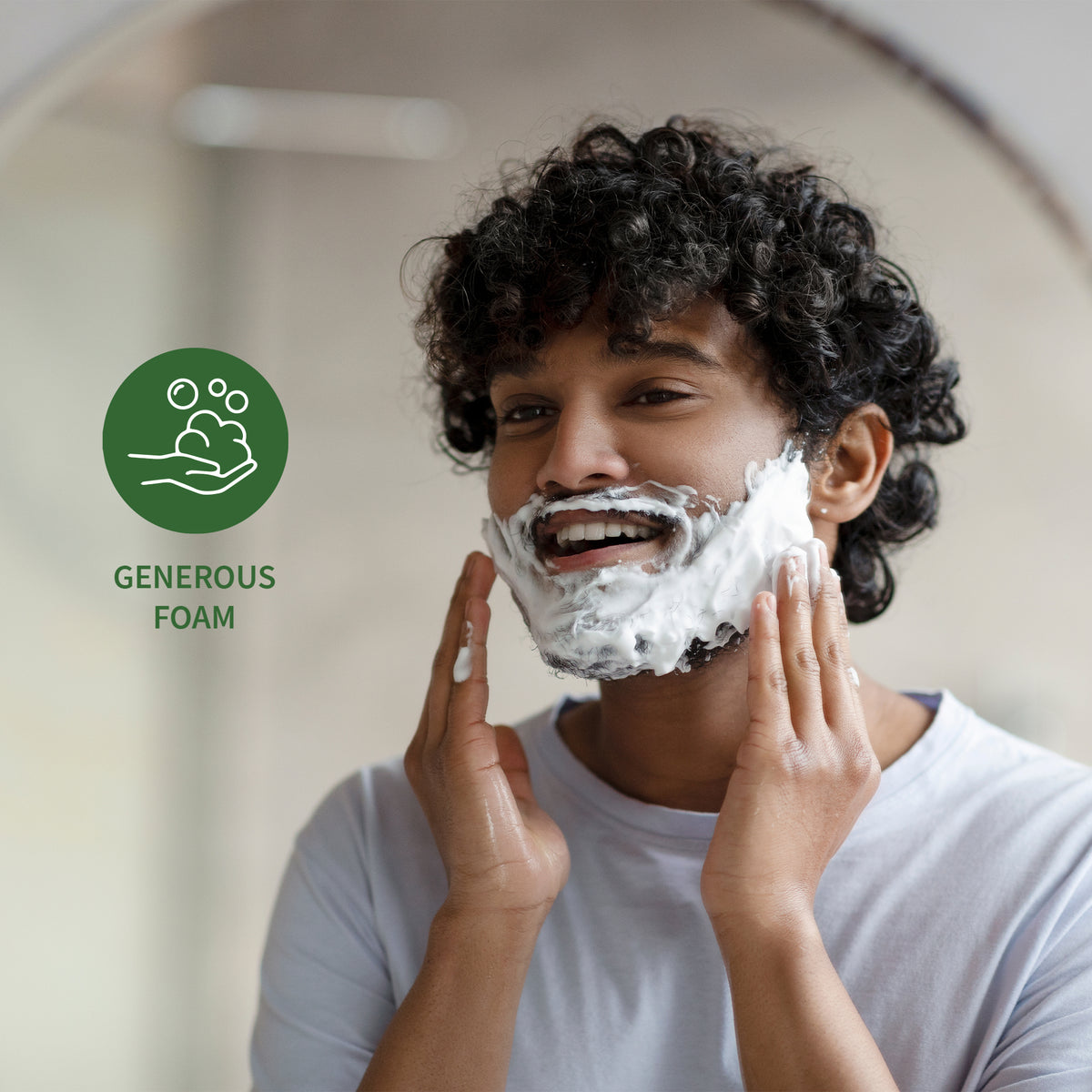 Close up of a person with shaving foam on their face during grooming