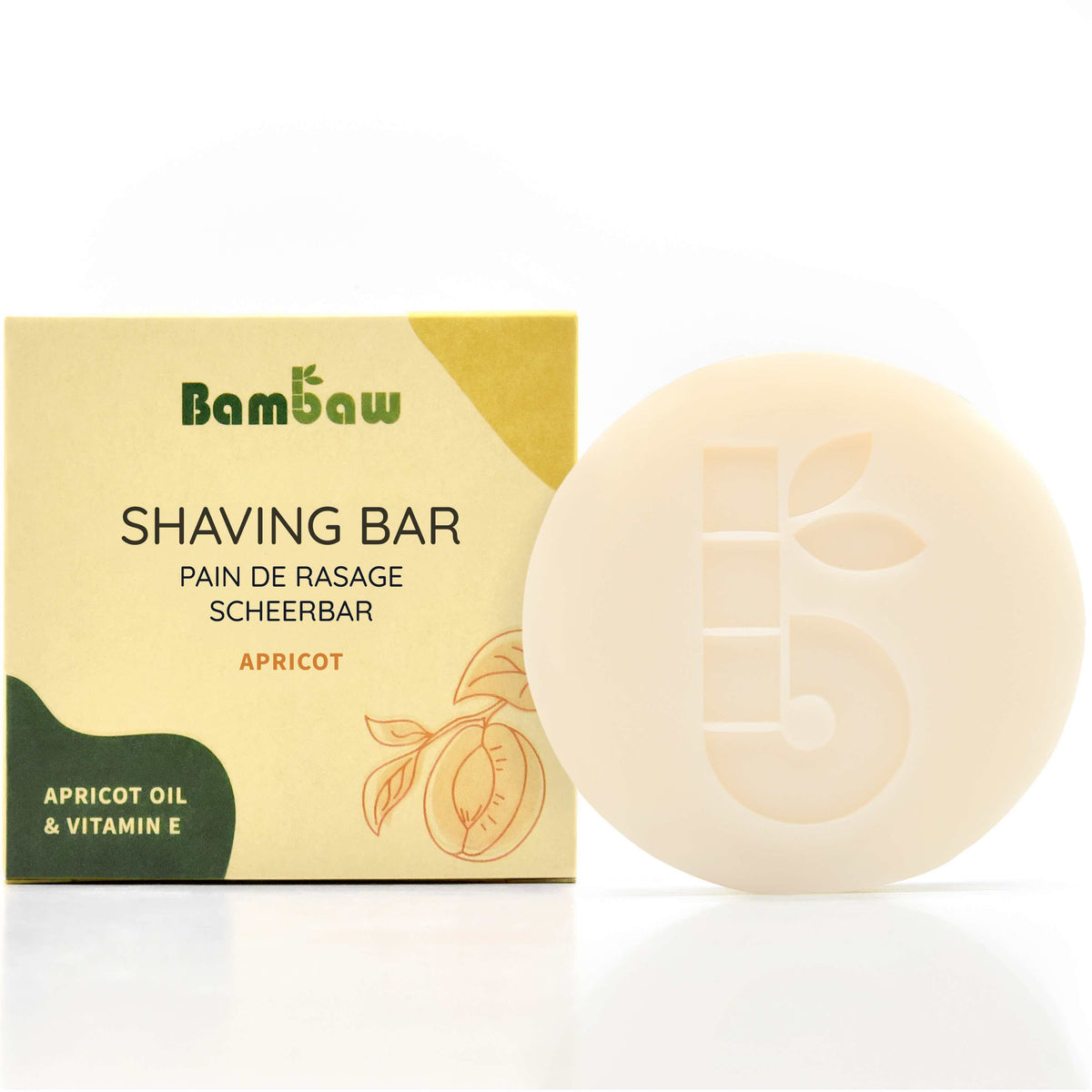 Shaving Bar packaging box labeled APRICOT OIL &amp; VITAMIN E beside a pale soap