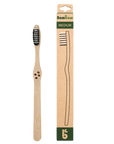 Bamboo toothbrush with medium bristles shown beside its packaging labeled MEDIUM