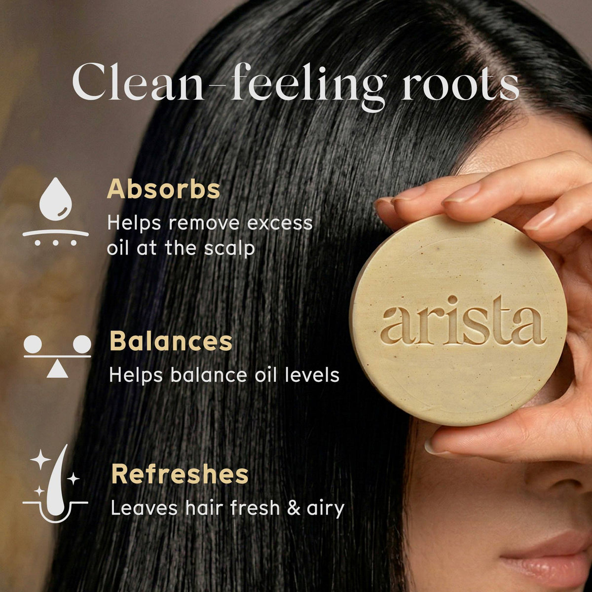 Person holding a bar of arista oily hair shampoo with text about its benefits for hair care.