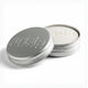 Silver shampoo bar tin with 'arista' branding on a white background