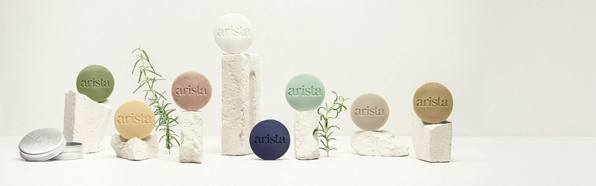 Collection of Arista shampoo bars on a white background