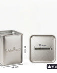 Metallic blade bank tin with dimensions and weight displayed on a white background