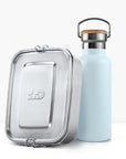 Pastel blue insulated bottle beside a silver metal lunch tin.