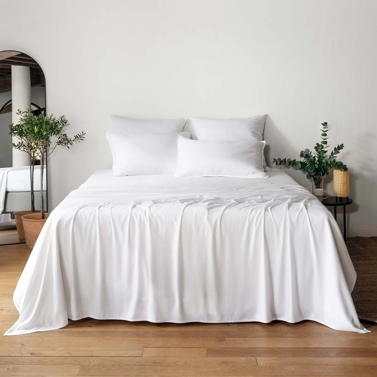 White bambaw cozy bamboo bedding set on a bed with a minimalistic room setting.