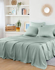 Bed with green bambaw cozy bamboo bedding in a bedroom setting