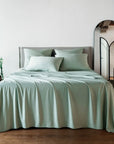 Bed with light green bambaw cozy bamboo bedding in a bedroom setting