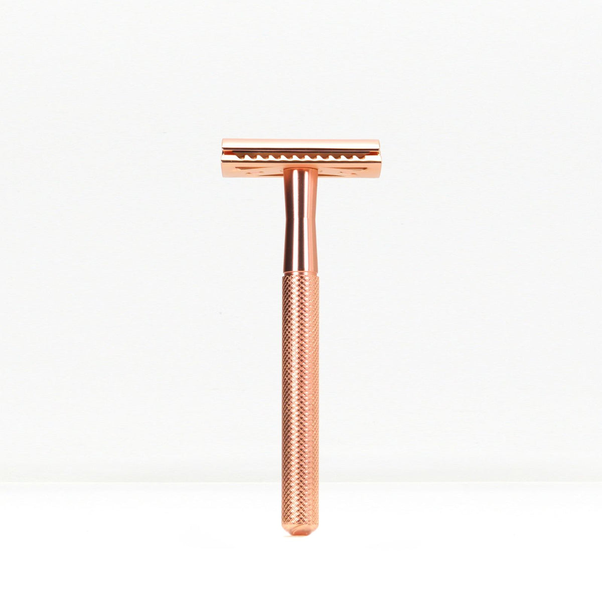 Bambaw Rose gold safety razor on a white background