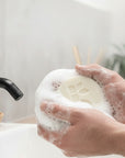 Bamboo shaving kit featuring a wooden handle razor and round soap in a clean display.