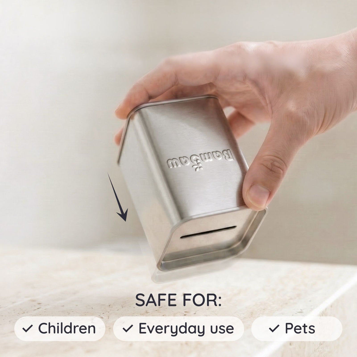 Hand holding a metallic blade box container with Bambaw branding, labeled as safe for children, everyday use, and pets on a light background.