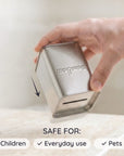 Hand holding a metallic blade box container with Bambaw branding, labeled as safe for children, everyday use, and pets on a light background.