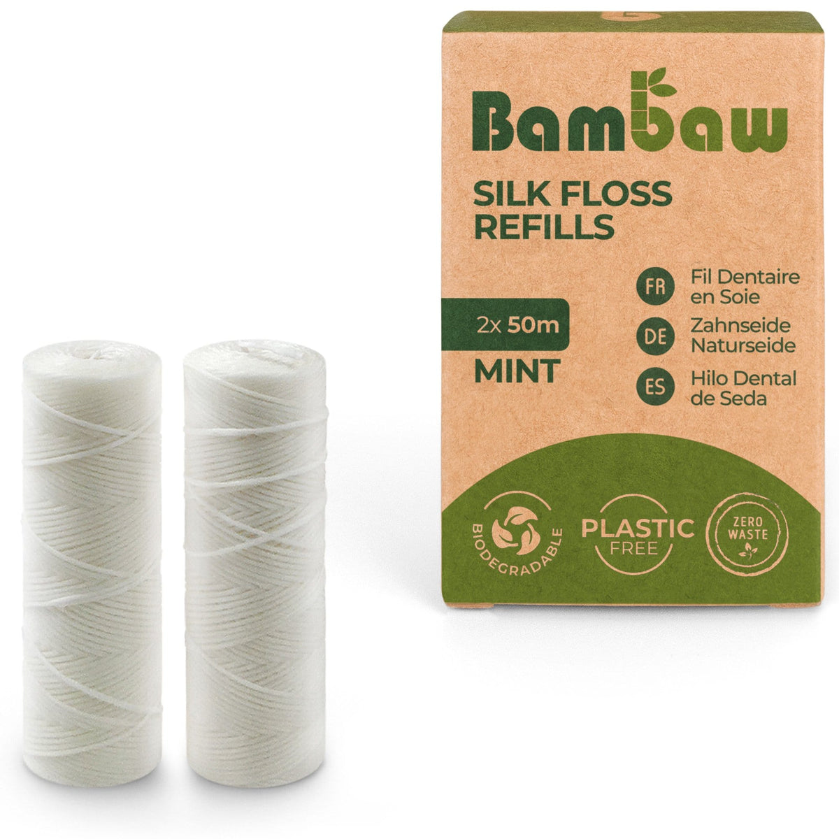 Two white silk floss spools next to a brown Bambaw Silk Floss Refills box