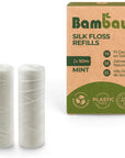 Two white silk floss spools next to a brown Bambaw Silk Floss Refills box