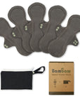 Five dark gray reusable pads arranged together with a storage pouch and Bambaw heavy flow pack box