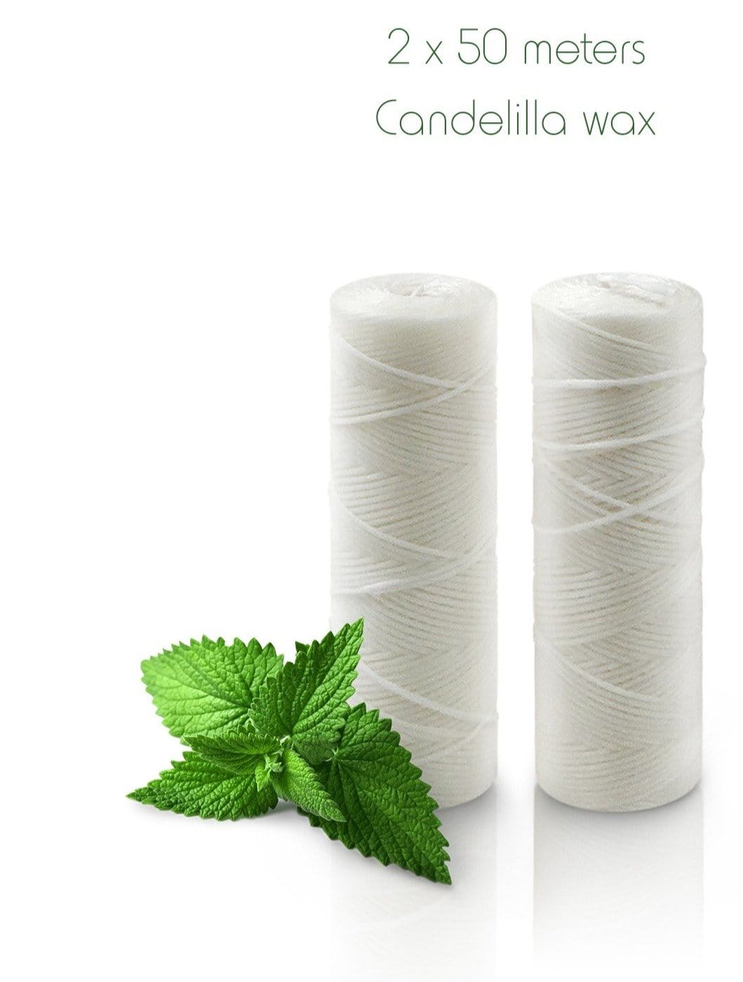 Two white floss spools with mint leaves beside Candellila wax packaging showing 2 x 50 meters