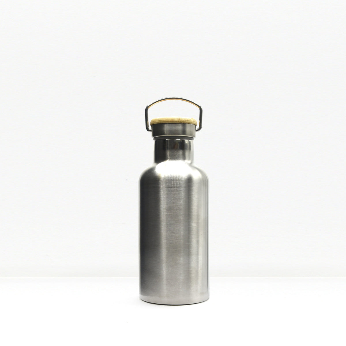 Close up of the insulated water bottle neck with a wooden cap and metal carrying handle.