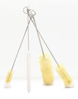 Set of five bottle brushes with twisted cords and metal hanging loops against a white background.