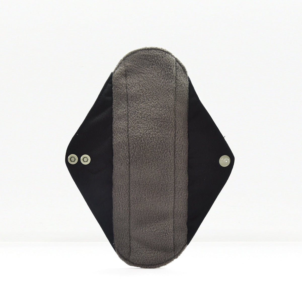 Close-up of a grey fabric reusable sanitary pad with black wings on a white background