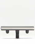 Safety razor head mounted on a threaded post with a silver housing against a white background