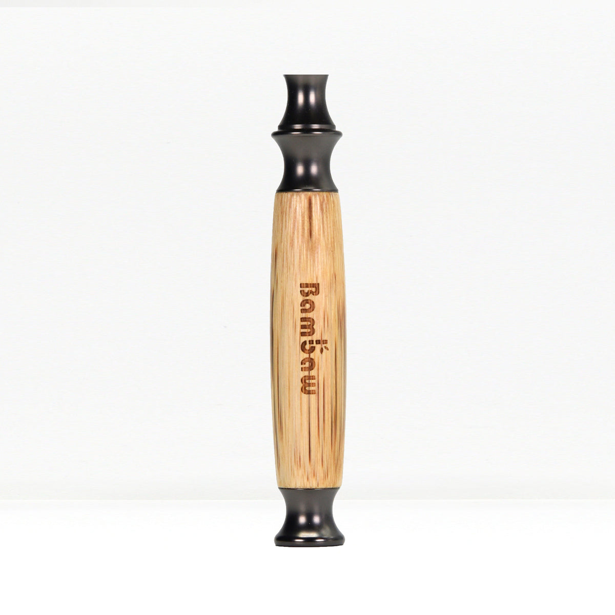 Close up of bamboo razor handle with engraved text along the wood and black end cap
