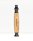 Close up of bamboo razor handle with engraved text along the wood and black end cap