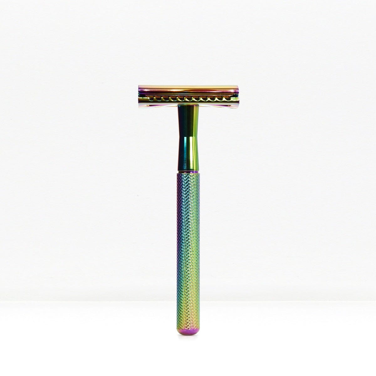 Rainbow iridescent safety razor with a knurled handle standing upright