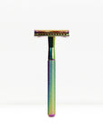 Rainbow iridescent safety razor with a knurled handle standing upright