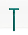 Teal metal double edge safety razor with a knurled handle standing upright