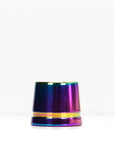 Iridescent metal safety razor stand on a white surface