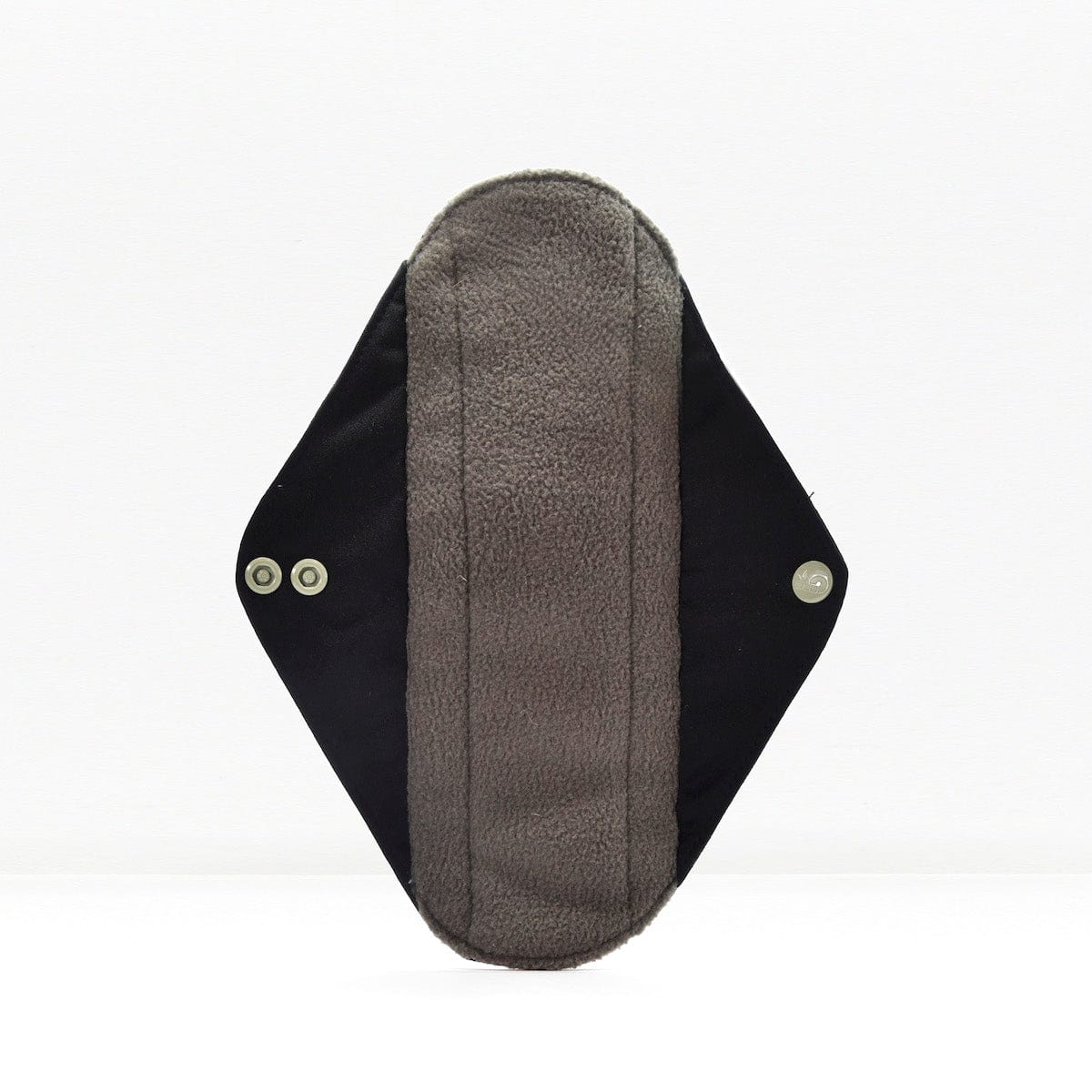 Single reusable panty liner with soft fleece interior and dark outer fabric with snap fasteners