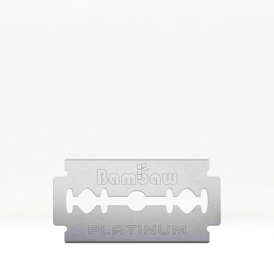 A single safety razor blade with platinum coating, with the brand name 'Bambaw' visible on it.