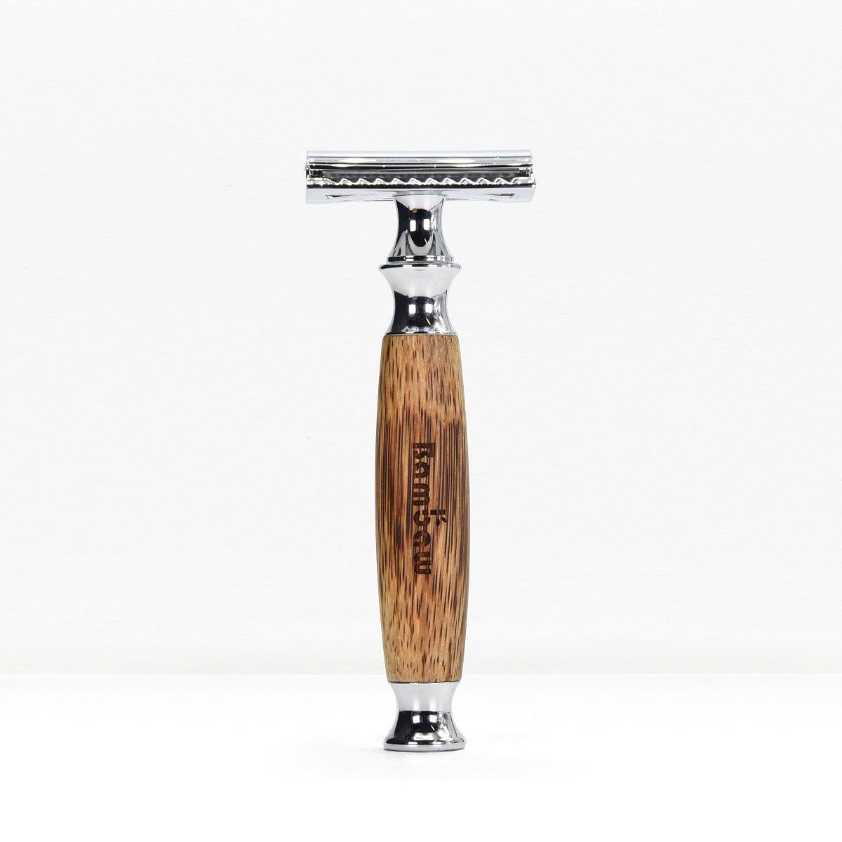 Bamboo safety razor with a natural wood grain handle and chrome head standing upright on a white background