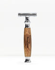 Bamboo safety razor with a natural wood grain handle and chrome head standing upright on a white background
