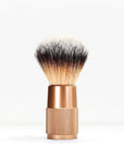 Shaving brush with cream bristles fading to black and a copper knurled metal handle